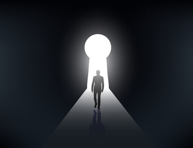 silhouette of a man walking in the light from the keyhole